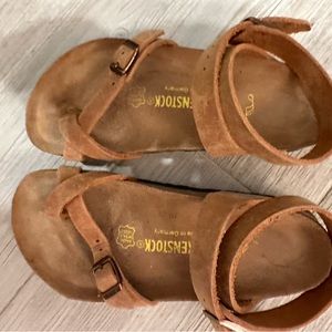 Birkenstock natural color size 35 which is 5-5.5..  New, worn once